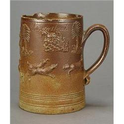 A London salt-glazed stoneware dated commemorative mug, applied with figures from a fox hunt, tre...