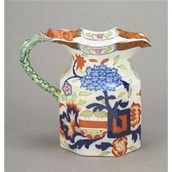 An English ironstone octagonal jug, of Fenton-type shape with moulded dragon's head upper termina...