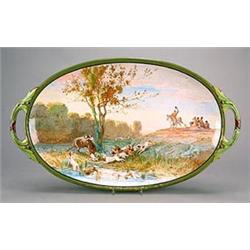 A Minton pottery oval two-handled tray painted by Eduard Rischgitz (1828-1909), depicting a stag...