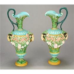 A pair of English majolica ewers, possibly George Jones, the flared necks with scroll handles abo...