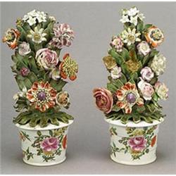 A pair of Bow models of flower-pots issuing flowers, the flower-pots painted with sprays of flowe...