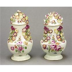 A pair of Derby flower-encrusted baluster pot pourri vases and covers, painted in coloured enamel...