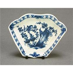 A Worcester blue and white fan-shaped section from an hors d'oeuvres set, painted with a bird amo...