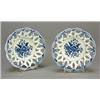 A pair of Worcester blue and white pierced circular baskets of interlaced ovals, the wells printe...
