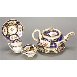 A Coalport dark-blue-ground 'Etruscan' shape part tea service, painted with gilt-lined panels of...