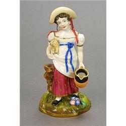 An English bone china model of a shepherdess, possibly Minton, modelled standing, holding a lamb...