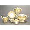 Image 1 : A Minton porcelain 'Rococo revival' pale-yellow-ground part tea service, gilt with borders og scr...