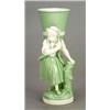 Image 1 : A Minton 'Celadon'and white porcelain figural posy holder, modelled as a girl with a large basket...
