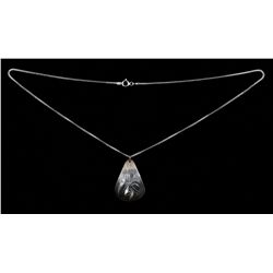 Northwest Coast Pendant with Incised Raven Design Marked RK 1 1/2" H. 7/8" W.  Fine Condition