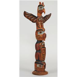 Charlie James Totem Carved with Thunderbird, Bear with Human Holding a Ceremonial Copper and a Seal 