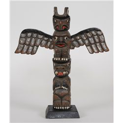 Salish Totem Carved with Thunderbird and Bear by Cicero August - Duncan, B.C.  12 1/2" H. 11" W.  Go