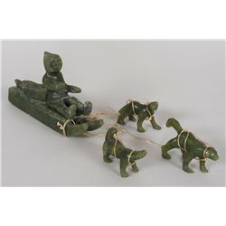 Inuit Serpentine Carving of a Dog Sled Team ca. 1960 - Artist Unknown 11" L 3" H.  Good Condition