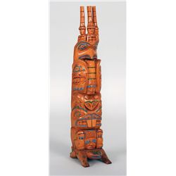 Haida Totem Carved with Three Watchmen with Chief's Hats, Eagle with Chief Between Wings, Frog, Beav