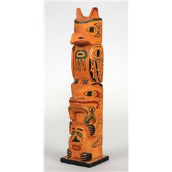 Totem Carved with Raven, Bear Holding Fish and Slave by Wilford Stevenson - Greenville, Nass River, 