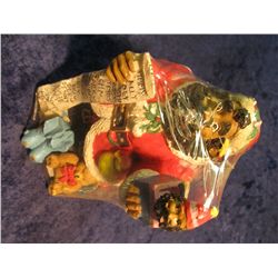 1. African American Santa Figurine with list of good children. 5 1/2" tall.
