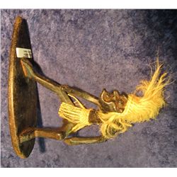 3. Carved Wooden Figure of African Native riding a Surf Board.