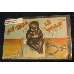 13.  Racist art and black memorabilia. "My Tale is "Told"" Postcard. Boy sitting on ice block.