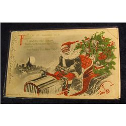 20. Black Santa Christmas Card.  Depicts Santa driving an old car with a decorated Christmas Tree in