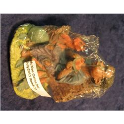 27. Racist Art and black memorabilia Figurine of Afro American boy sitting on log eating watermellon