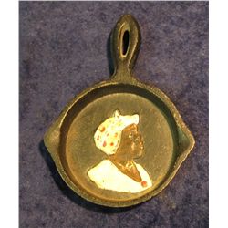 28. Racist Art and black memorabilia Iron Skillet with raised portrait of a female Afro American coo