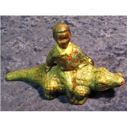 33. Racist Art and black memorabilia Cast Iron Alligator with an Afro American on his back. 3 1/4" x