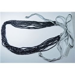 MULTI STRAND NECKLACE WITH TIE BACK. APPROAXIMATLEY 9 1/2" IN LENGTH BUT CAN BE