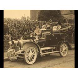 A Black and White Photograph of a Car Belongi...