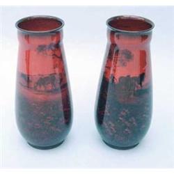 A pair of Royal Doulton flambe vases of tapering rounded form with ogee rim decorated with cattle...
