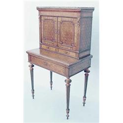 A 19th century French ormolu mounted parquetry bonheur du jour with 2 doors and drawers over a hi...