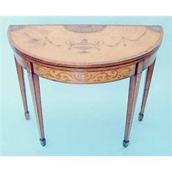 A George III satinwood demi-lune folding top card table, cross-banded in kingwood and later inlai...
