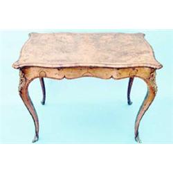 A Victorian figured burr walnut card table banded in tulipwood and having serpentine folding top...