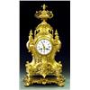 Image 1 : EMPIRE STYLE GILT BRONZE MANTEL CLOCK French. 19th Century. The pierced architectural case center...