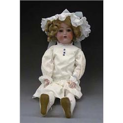 BISQUE HEAD DOLL German. Incised Simon & Halbig, K Star R, 29 and X at top of head. With blue gla...