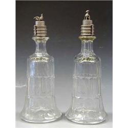 UNIQUE PAIR OF MOLD BLOWN GLASS DECANTERS American. 19th Century. Each pewter stopper with three...