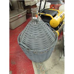 GLASS CARBOUY WOOVEN INTO WICKER BASKET