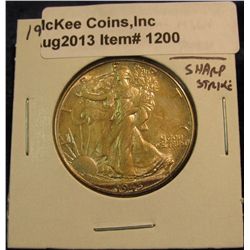 1200. 1945 P U.S. Walking Liberty Half Dollar. Toned MS 64 with a sharp strike.