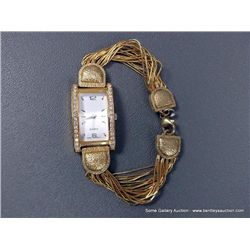 Liquid Gold Women's Quartz Watch Weight: 40.2 Grams Retail: $590.00