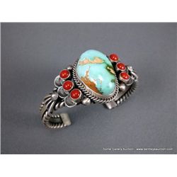 Sterling Silver Bracelet w/ 1 Large Turquoise, 6 Red Stones-Marked Derrick Weight: 62.1 Grams Retail