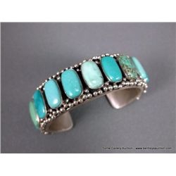 Sterling Silver Bracelet w/ Turquoise Stones- Marked Paul Livingston Weight: 86.2 Grams Retail: $990