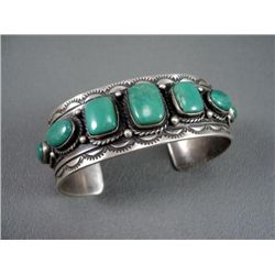 Sterling Silver Bracelet w/ Stamping and 7 Green Stones-Marked D. Johnson Weight: 61.1 Grams Retail: