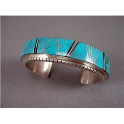 Inlaid Turquoise and Sterling Silver Bracelet- Marked M. Weight: 71.2 Grams Retail: $ 1,200.00