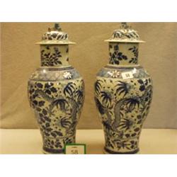 Two unsigned oriental blue and white antique lidded vases, approx. 20", repair to one £50 - 80...