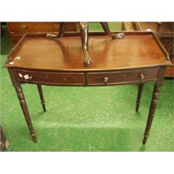 Regency mahogany bow fronted two drawer writing table on turned and tapering legs £280 - 320...
