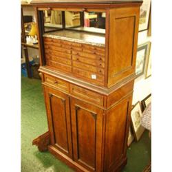 Superb walnut specimen cabinet with various sized drawers over two drawers and cupboards with sha...