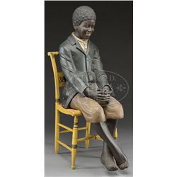 EXCEPTIONAL BLACK FOLK ART CARVING OF A YOUNG BOY (Late 19th/Early 20th Century) POSSIBLY OHIO.