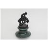 Image 1 : Miniature Remington sculpture copy on stand,  approx. approx. 6” in height.  Est.:   $50-$75.