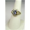 Image 1 : Stylish 14 karat yellow gold ladies ring set  with an oval Ceylon type color sapphire  weighing appr