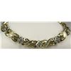 Image 1 : Brilliant 14 karat two-tone gold ladies  custom made bracelet channel set with 288  baguette and rou