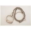 Image 1 : Bean single cuff on chain with metal ring and  key, in working order at time of  description, nickel