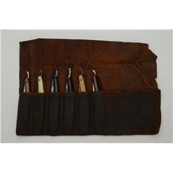 Lot of 6 misc. old straight razors in  uncleaned condition contained in folding  leather carry soft 